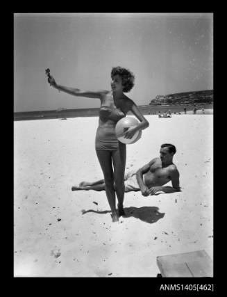 Couple modelling swimwear on Bondi Beach