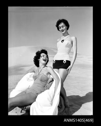 Negative depicting two women modelling swimwear