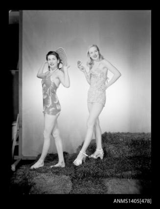 Negative depicting two women modelling swimwear