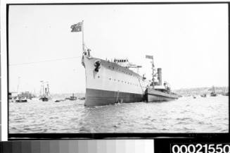 Ocean liner and assorted vessels in sydney Harbour