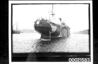 Armed merchant steamship in WWI dazzle camouflage being berthed in Woolloomooloo
