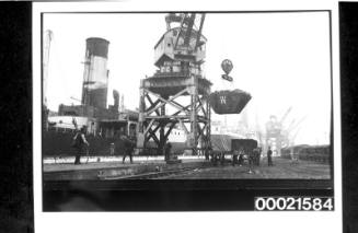 Loading coal at a wharf