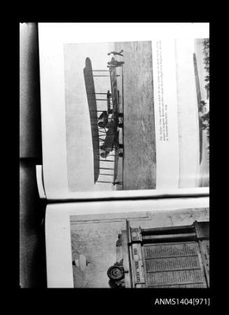 Photographic negative depicting a book with pictures of aircraft