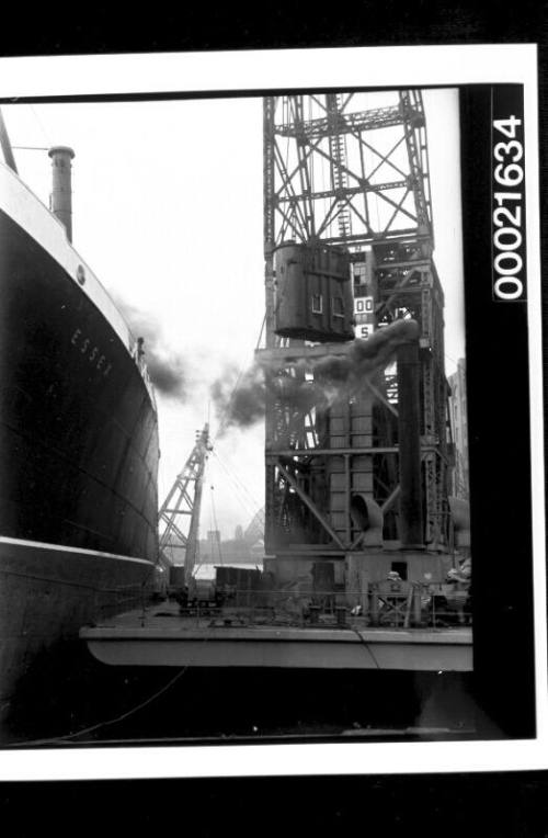 Floating crane TITAN being used to unload cargo from ESSEX, Jones Bay wharf, Pyrmont