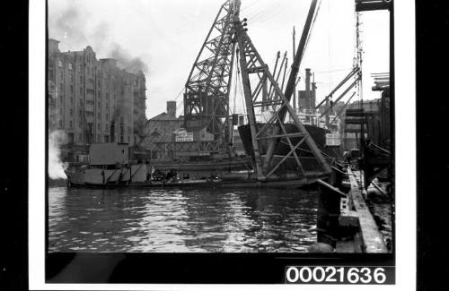 Floating crane TITAN being used to unload cargo from ESSEX, Jones Bay wharf, Pyrmont