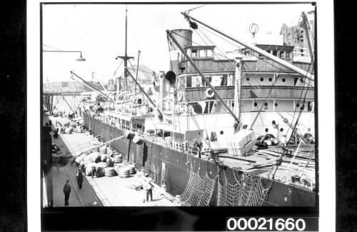 Wharf labourers loading bales into SS CANADIAN CRUISER