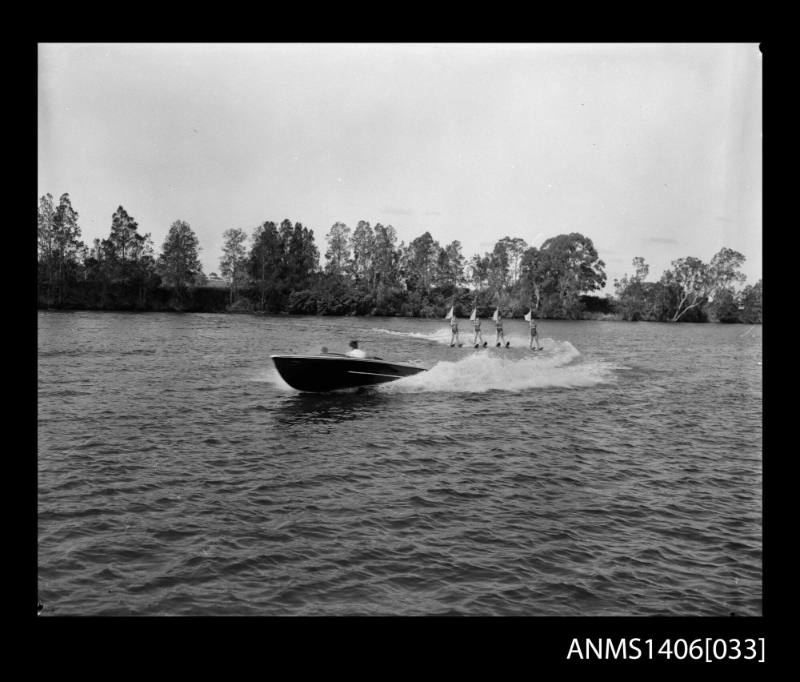 Negative depicting a motorboat, shown from portside bow and four water ...