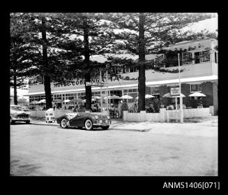 Negative depicting the Hotel Coolangatta with the Saloon Bar open out the front and cars parked in the street