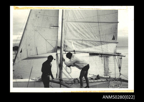 Mast, mainsail, trampoline of catamaran QUEST III at Sorrento Sailing Club