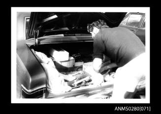 MISS NYLEX crew member looking at equipment in car boot during 1974 ICCT match period