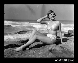 Negative depicting a woman in a bikini