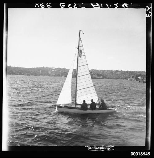 15'foot  Vee Ess Dingy racing on main harbour with 3 crew and unusual bowsprit.