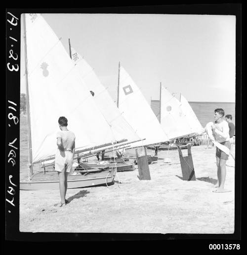 Veejay sailing dinghies on beach waiting to race