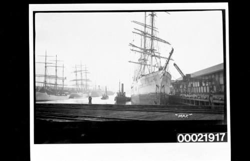 View of MAX alongside wharf in harbour.