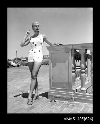 Model in swimsuit near Bondi Beach carpark