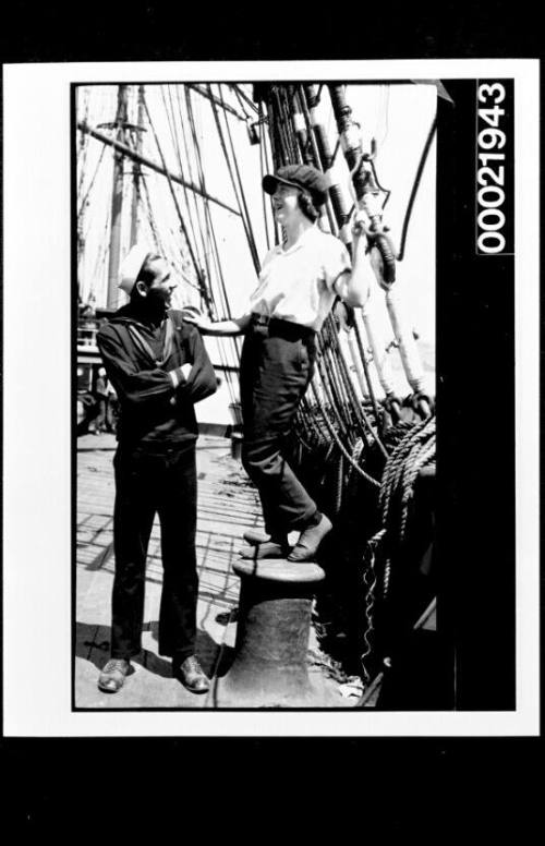 Unidentified mariner and young woman on the deck of a vessel