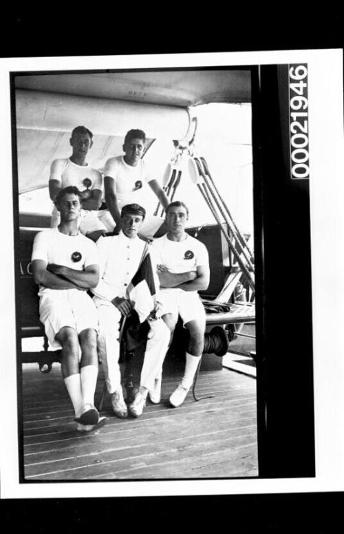 PORT JACKSON training ship - cadets in sports gear seated with an officer who holds the Devitt & Moore Line house flag