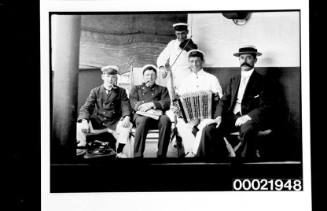 Group of officers relaxing and playing music on deck