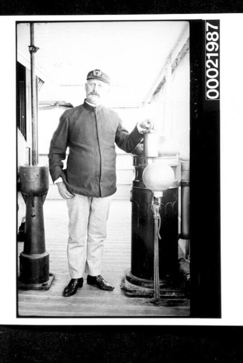 Merchant mariner on lower bridge of powered vessel