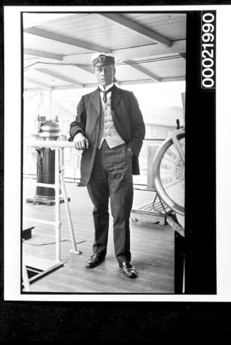 Merchant mariner  standing on navigation bidge