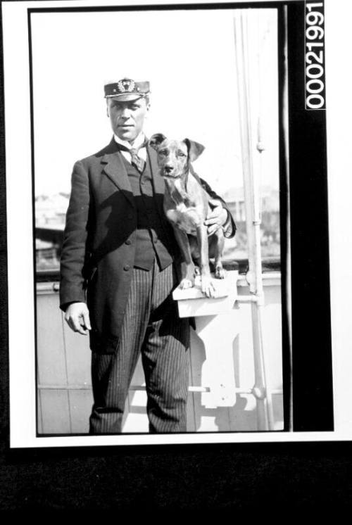 Sailing ship captain with pet dog