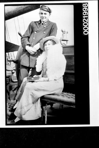 Unidentified merchant mariner and woman on board a vessel