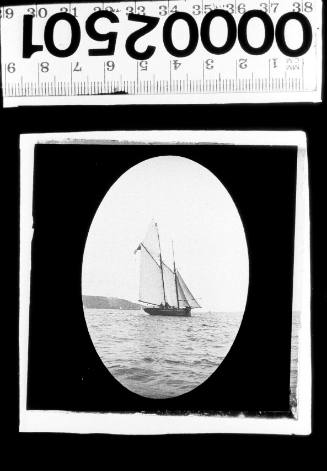 Stern and starboard view of schooner under sail, possibly CANOMIE