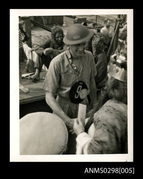 Crossing the Line ceremony on HMAS KANIMBLA  (Note this image contains offensive depictions of First Peoples and may cause trauma for people whose identities are directly impacted)