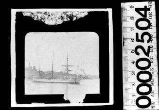 Starboard view of an unidentified barquentine at anchor off Pyrmont, Sydney, with the Colonial Sugar Refinery seen in the background