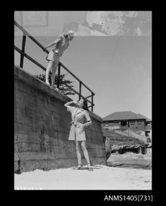 Negative depicting two women modelling beach wear