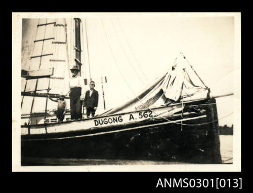 Man and two boys on board DUGONG [A. 562]