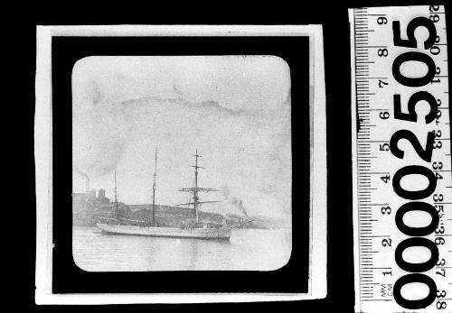 Starboard view of a barquentine sailing ship at anchor off Pyrmont, Sydney, with the Colonial Sugar Refinery visible in the background