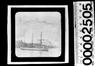 Starboard view of a barquentine sailing ship at anchor off Pyrmont, Sydney, with the Colonial Sugar Refinery visible in the background