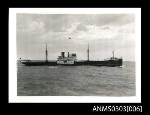 Starboard view of a small merchant ship under way