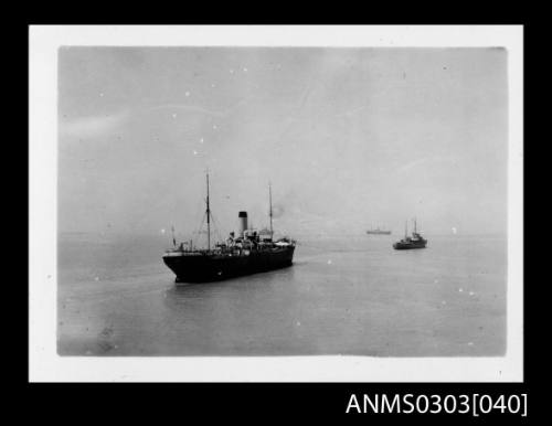 Merchant ship being towed at Bandar Shapur, Iran, after the port's capture in August 1941