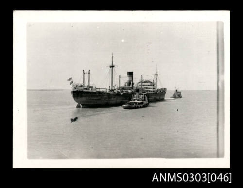 German ship, most likely HOHENFELS, under tow in the Persian Gulf after capture at Bandar Shapur