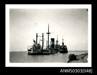 German cargo ship at the port of Bandar Shapur sunk to its upper decks