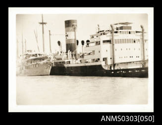 German cargo ship HOHENFELS listing to starboard side at port in Bandar Shapur.