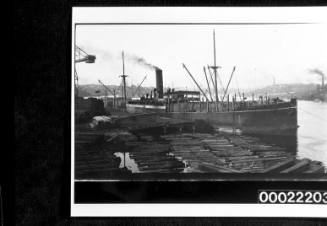 SS STRATHFILLAN berthed at a wharf loading or unloading timber