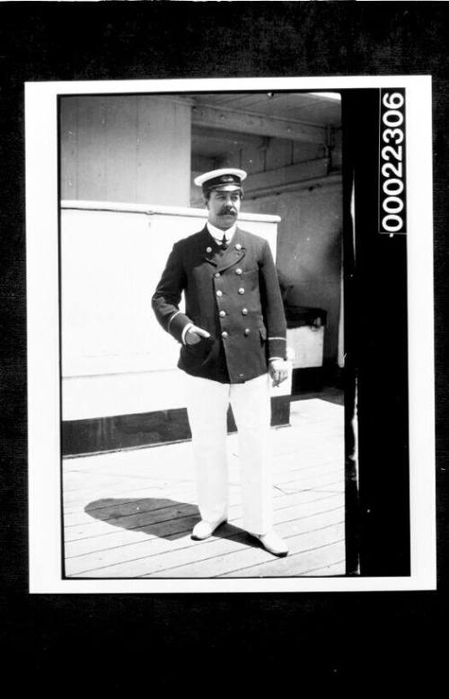 Ships and steamer crews, man in uniform standing and holding a cigarette