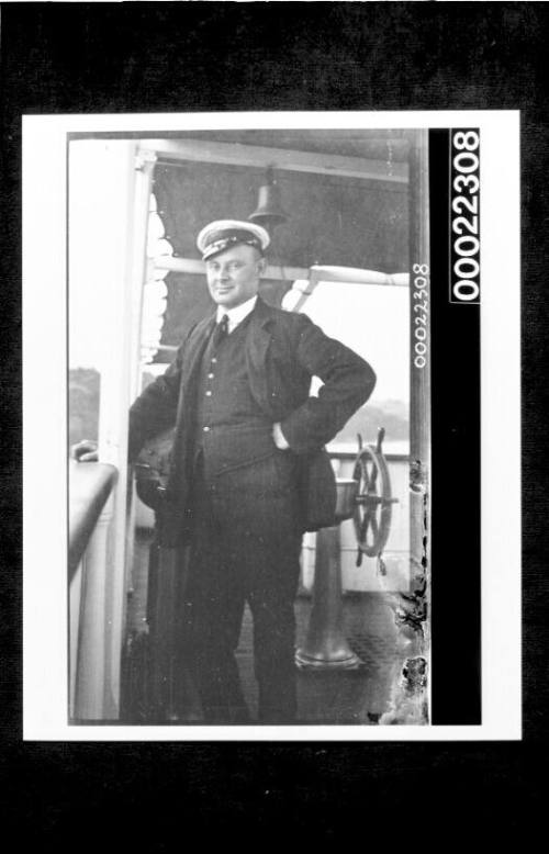 Ships and steamer crews, man standing on deck