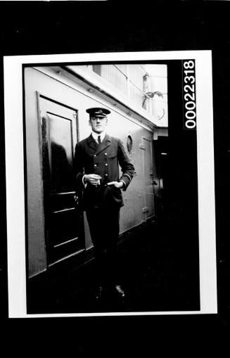 Man in black suit with cigarteer in hand