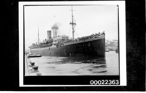 Liner leaving Pyrmont wharves with troops on deck