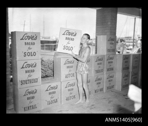 Man moving boxes of Love's bread