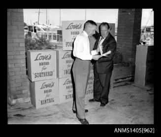 Man moving boxes of Love's bread