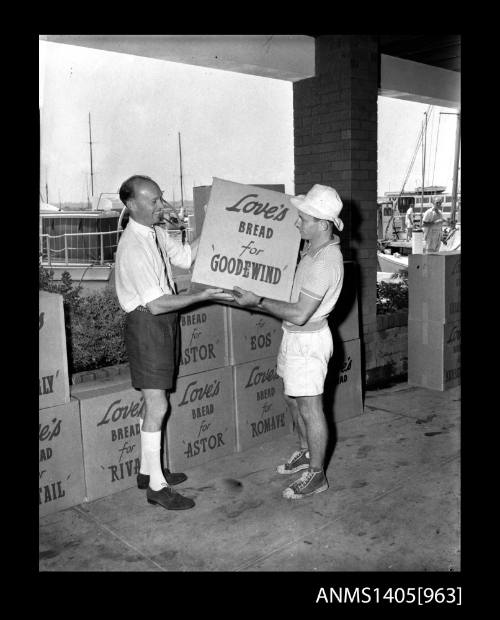 Man moving boxes of Love's bread