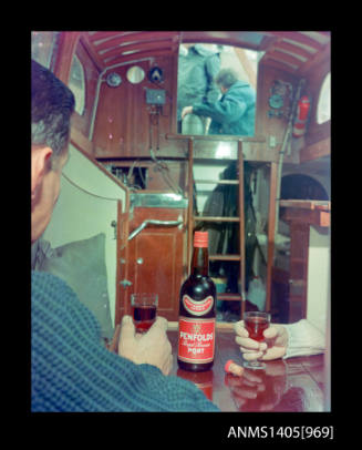 Bottle of Penfolds' port inside a boat's cabin