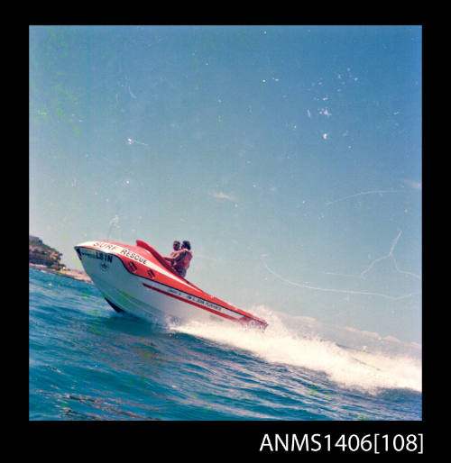 Transparency depicting two men aboard a Surf Rescue motor boat