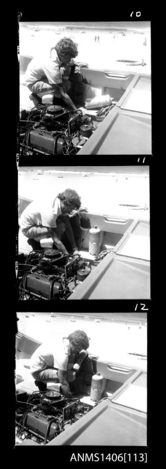 Negative depicting a man fixing an engine