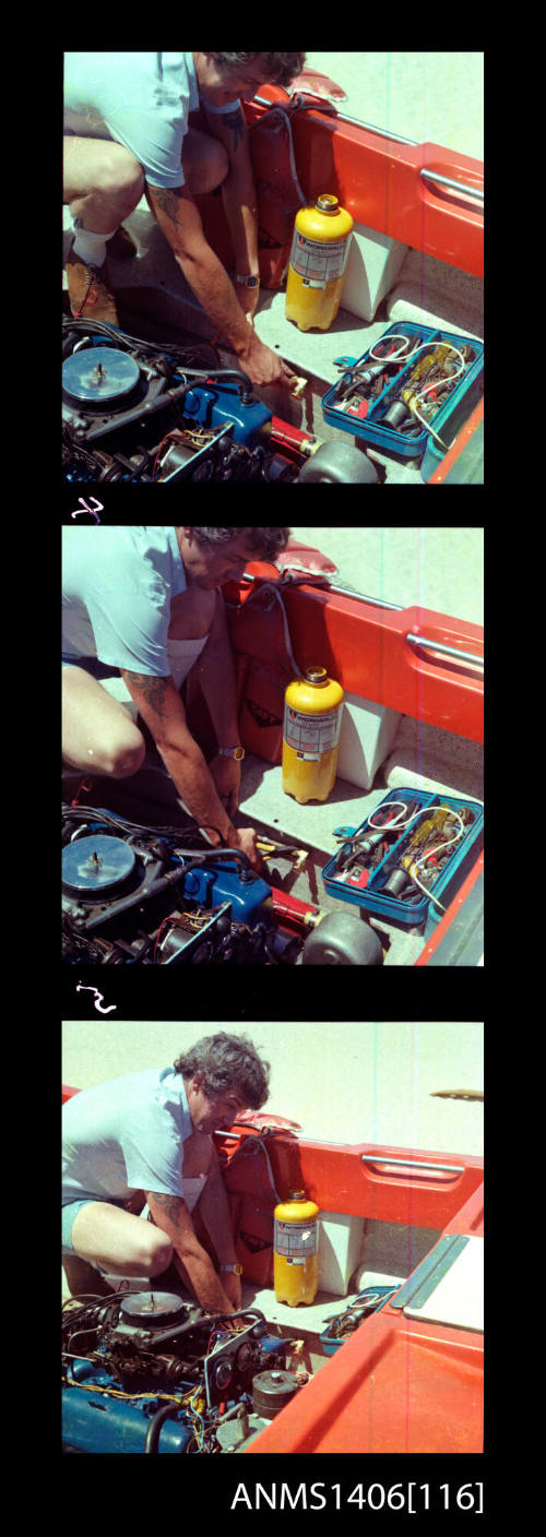 Transparency depicting a man fixing an engine